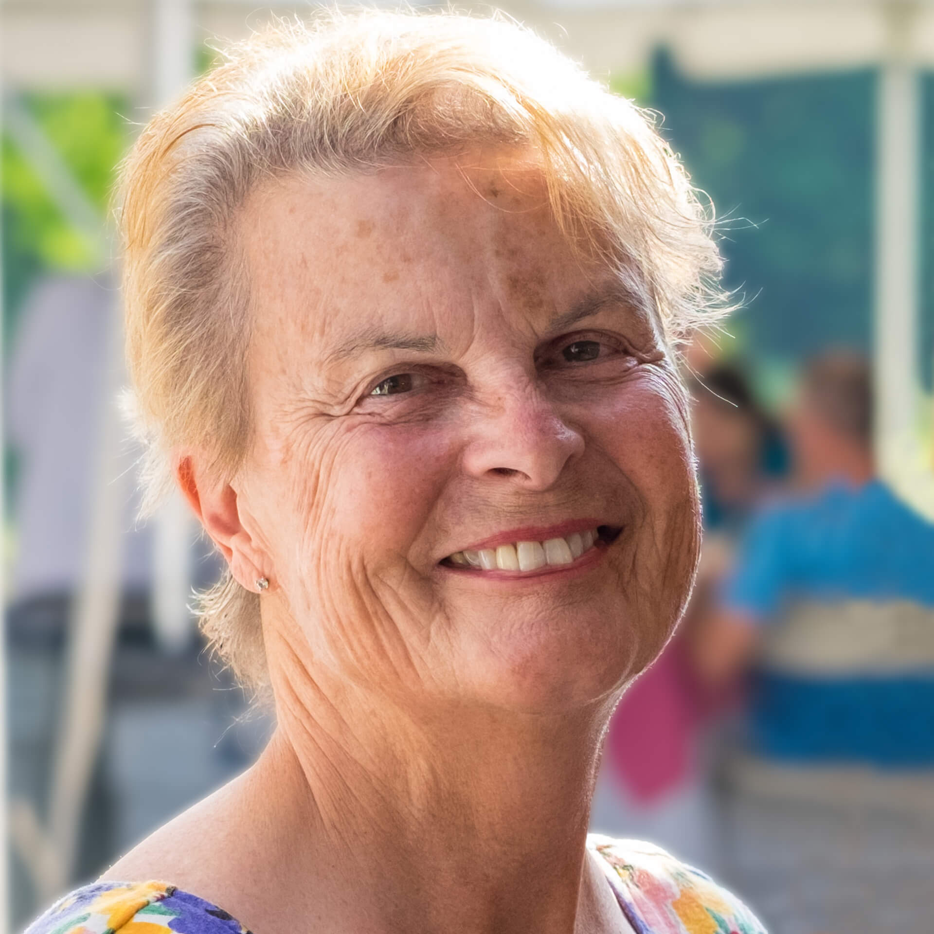 a woman with blonde hair smiling
